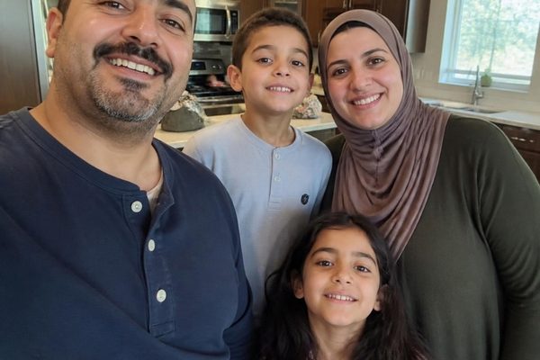 Family of four in their kitchen